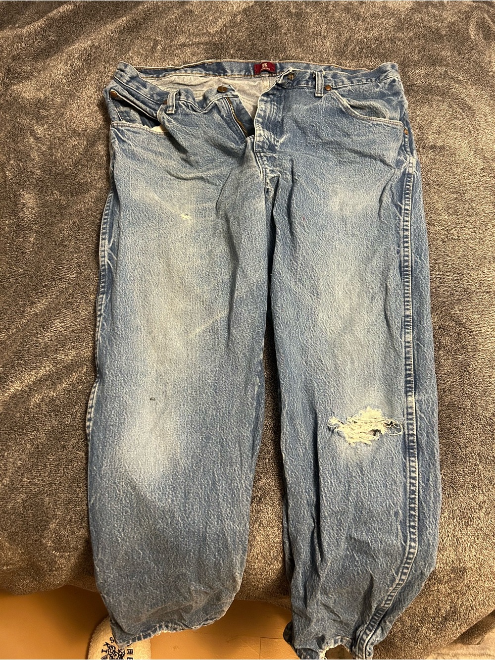 Wrangler Light Blue Relaxed Fit Jeans with Distressed Knee
